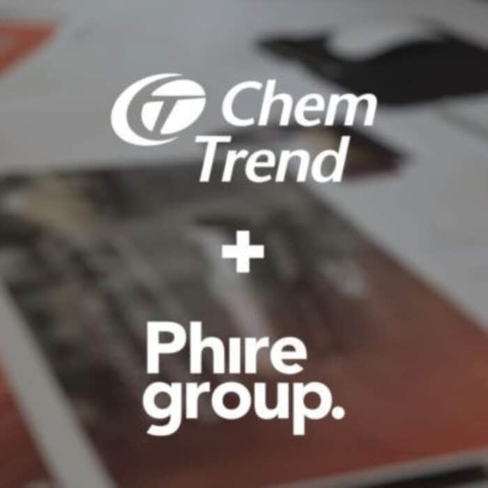 White text reads "Chem Trend + Phire Group" on a blurred background of papers and workspace, suggesting collaboration. Tone is professional and modern.