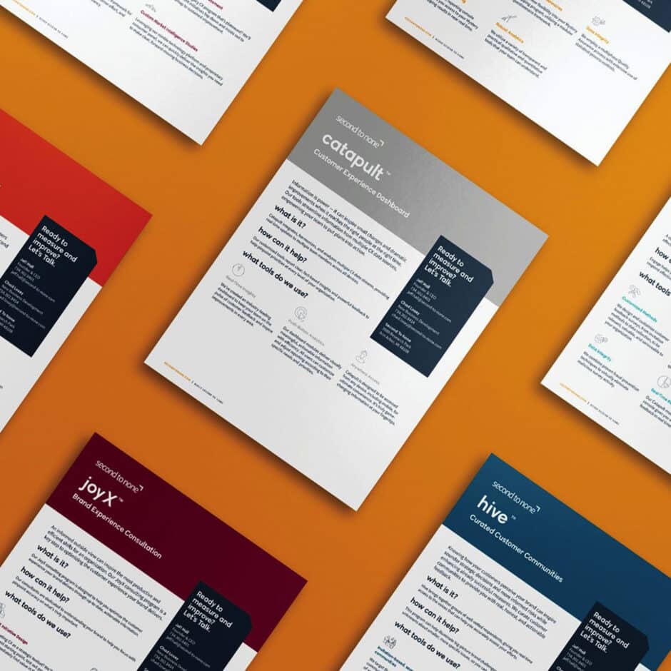 A set of professional, colorful brochures on a vibrant orange background. Each brochure varies in layout and color, featuring text and bold headings.