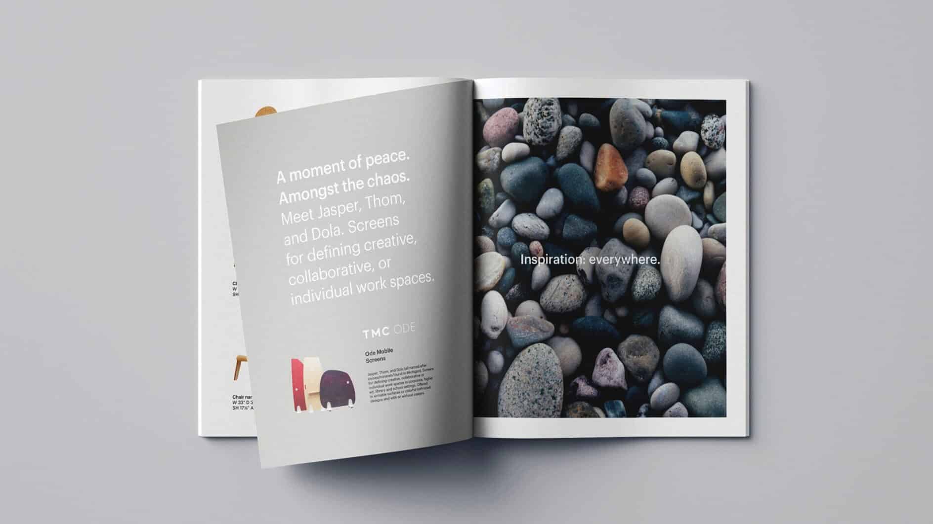 A magazine spread on a light surface. Left page features text and illustrations of chairs against a gray background. Right page shows smooth, colorful pebbles with "Inspiration everywhere." written across. Tone is calm and creative.