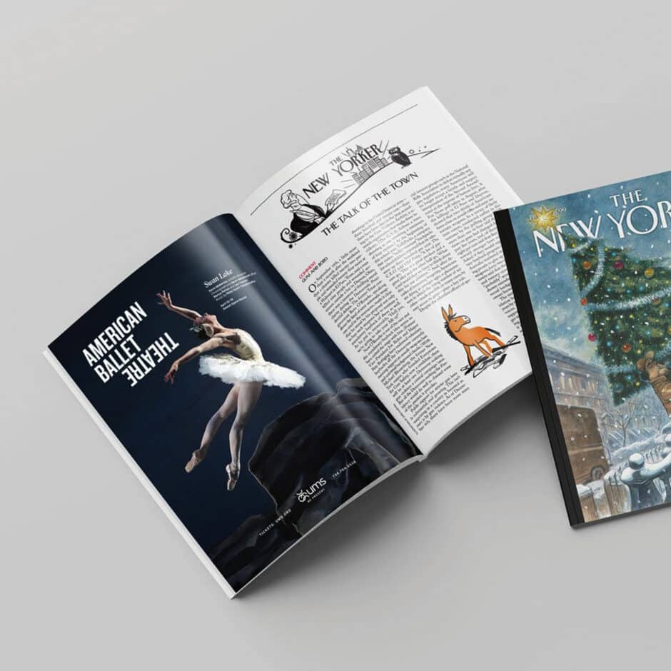 Open magazines on a light surface. One features an ad for "American Ballet Theatre" with a dancer performing. Another has text and an illustration of a dog. A third magazine cover shows a festive street with a decorated Christmas tree.