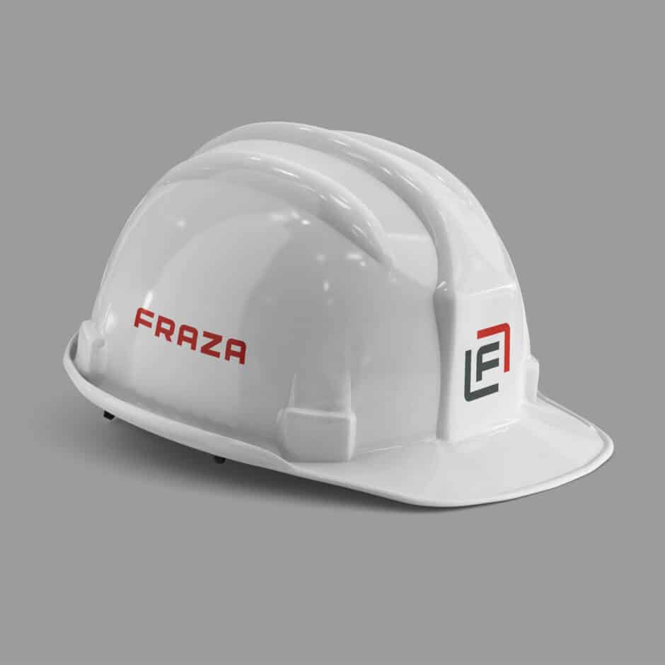 White construction helmet with "FRAZA" in red on the side and a black and red logo on the front against a gray background. Simple, professional design.