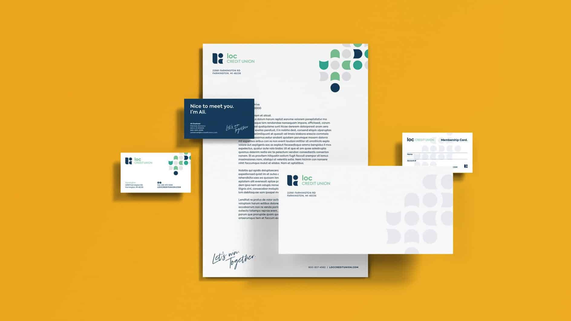 A set of modern business stationery on a yellow background. Includes letterhead, business cards, and an envelope featuring a clean design with geometric shapes in shades of blue and green, conveying professionalism and creativity.