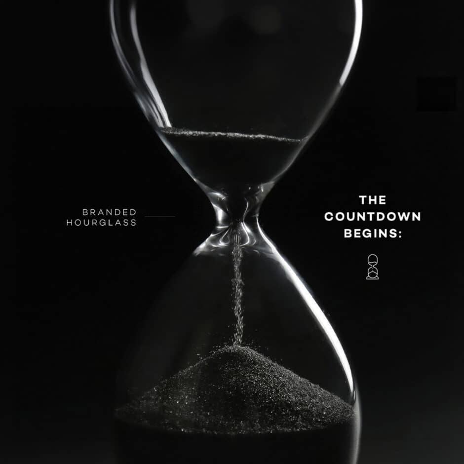 A sleek hourglass with black sand on a dark background, text reads "Branded Hourglass" and "The Countdown Begins," creating a dramatic, suspenseful mood.