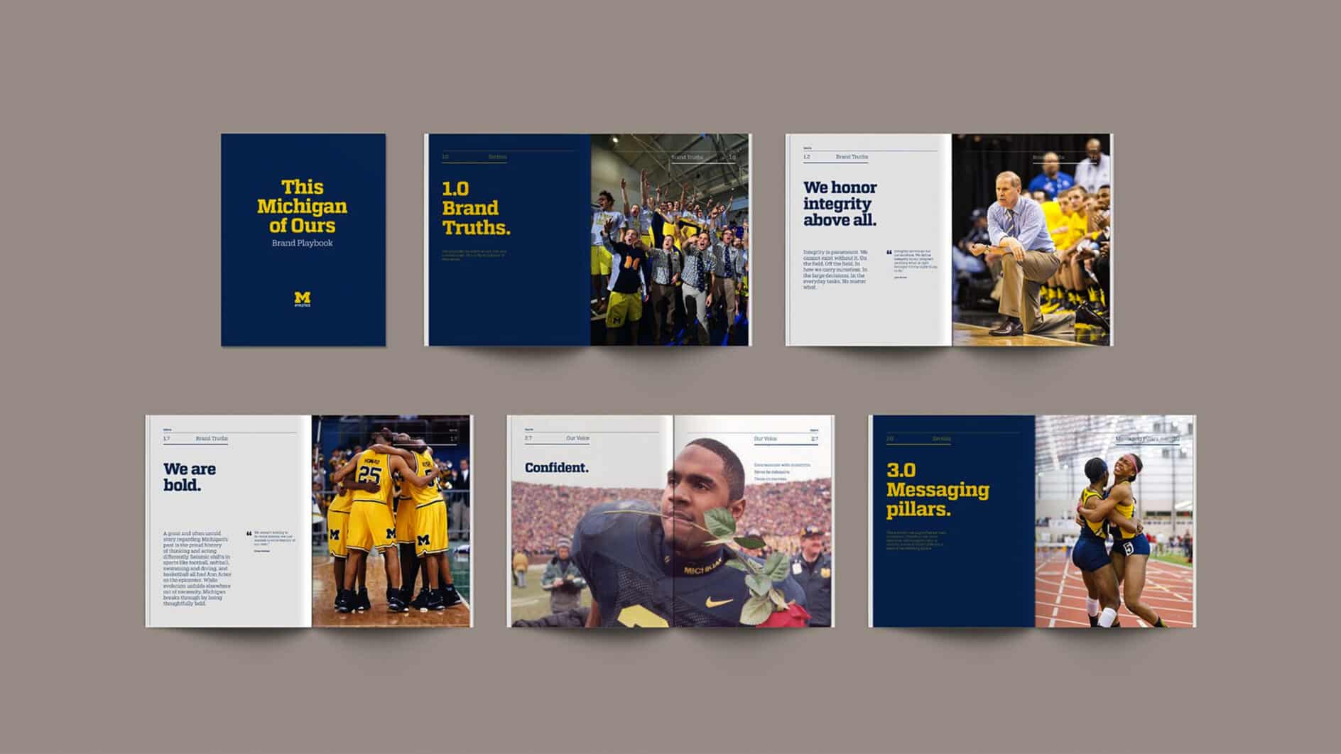 A series of open brochures showcasing University of Michigan branding. Highlights include athletes, team huddles, and key messaging pillars with bold text.