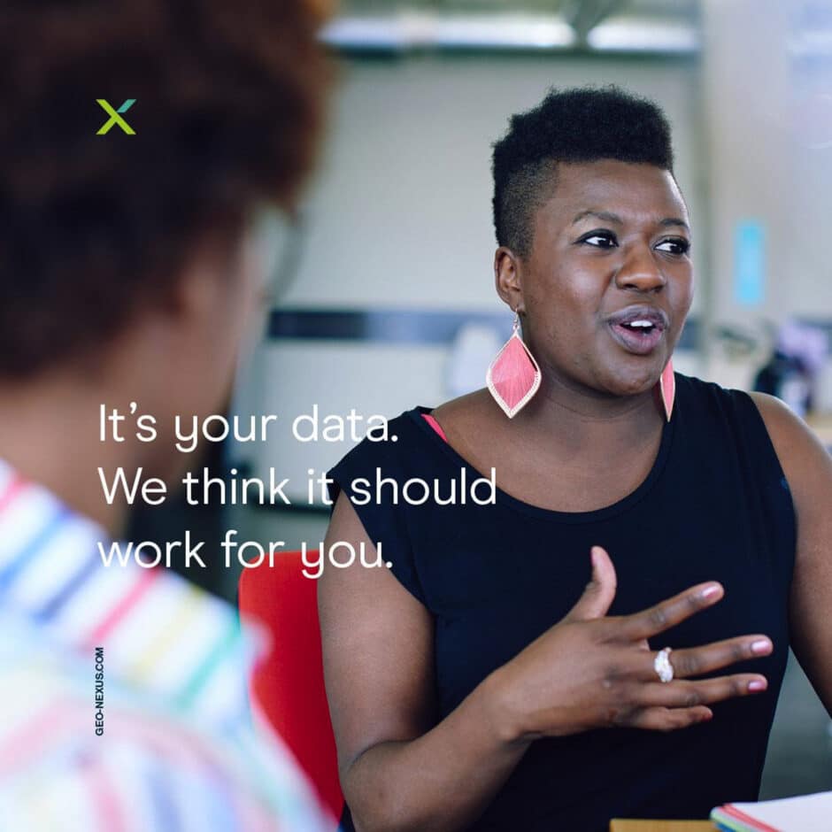 A woman with short hair wearing pink earrings gestures while speaking, expressing engagement. Text reads, “It’s your data. We think it should work for you.”
