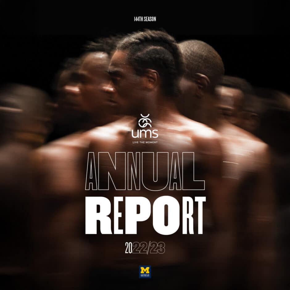 Blurred image of shirtless figures moving, creating a dynamic and energetic feel. Text overlay reads "UMS Annual Report 2022/23" with a logo.