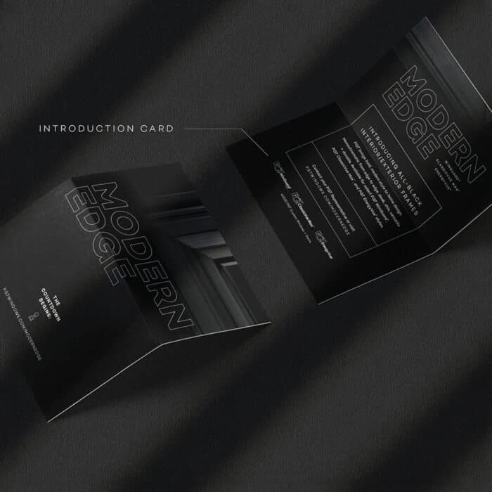 A sleek black introduction card with the text "Modern Edge" is shown both closed and slightly open on a textured dark surface, conveying elegance and sophistication.
