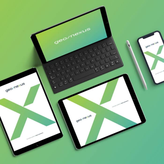 Digital devices on a gradient green background show the geo/nexus logo on screens. Includes a tablet with keyboard, stylus, two tablets, and a smartphone.