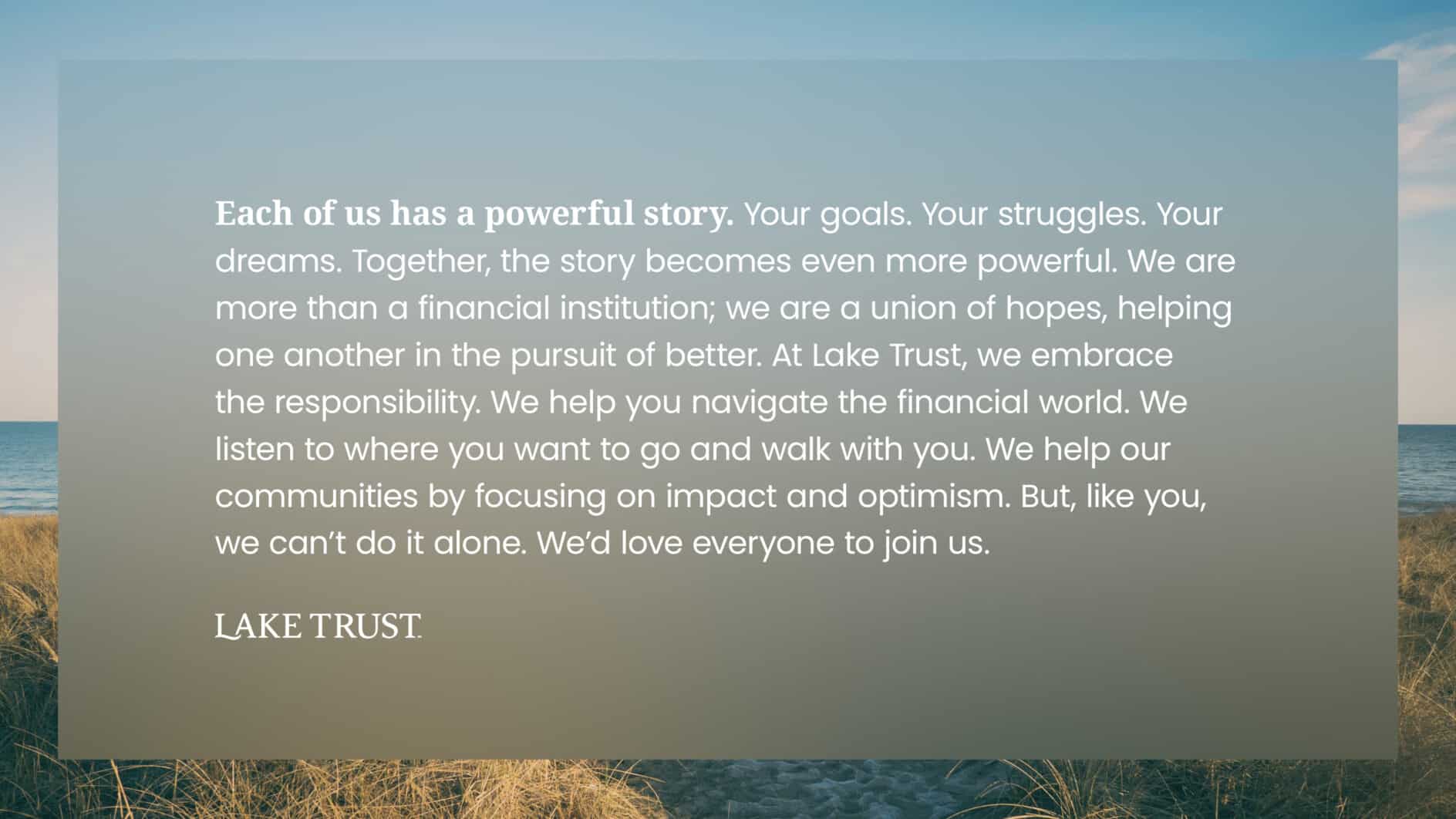 A serene beach with sea grass in the foreground and calm waters in the background. Overlaid text discusses unity, empowerment, and community support, ending with "Lake Trust."