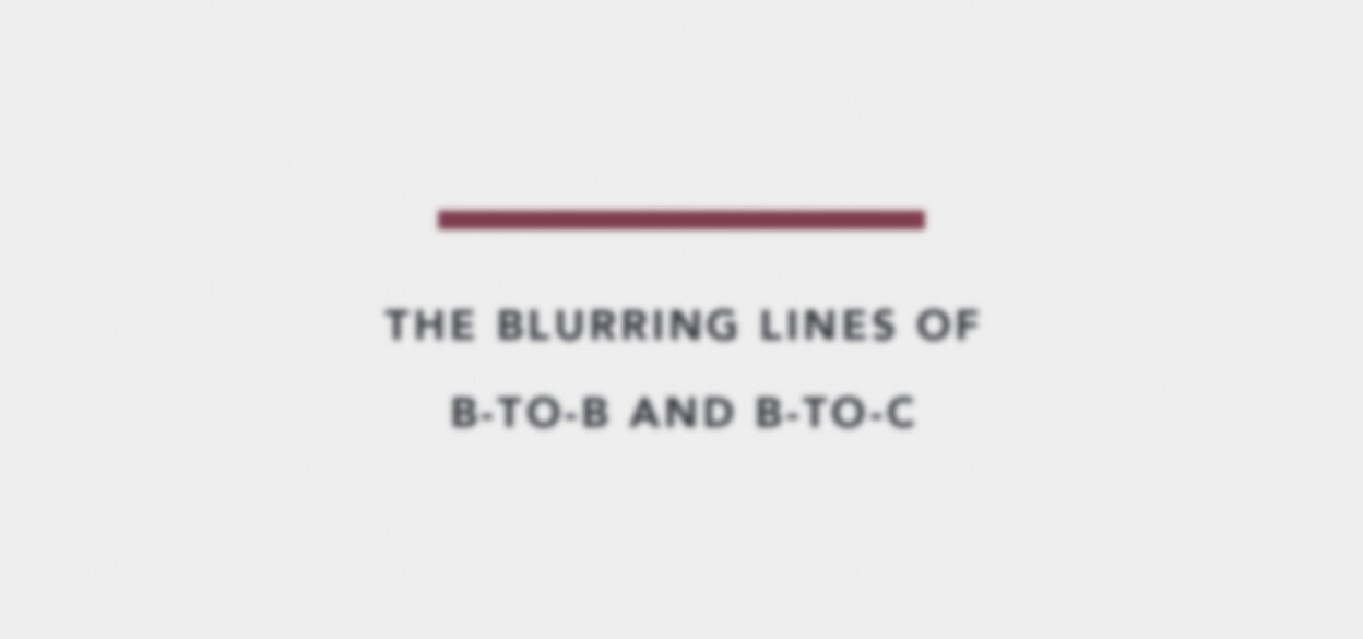 Blurred text on a white background reads, "The Blurring Lines of B-to-B and B-to-C," with a thick maroon line above, suggesting convergence and change.