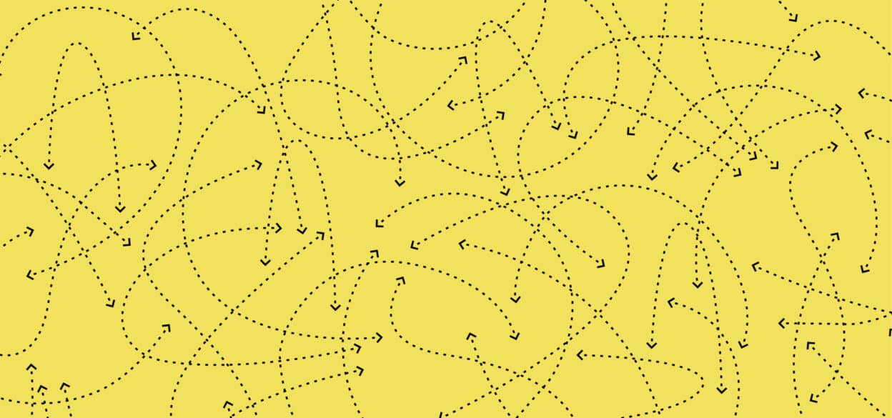 Yellow background with black dotted arrows scattered randomly, creating a chaotic, dynamic pattern. The image conveys motion and randomness.