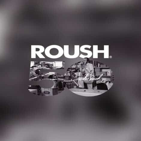 Text "ROUSH 50" overlays a workshop scene with a man, tools, and machinery. The tone is nostalgic and industrial, celebrating a milestone.