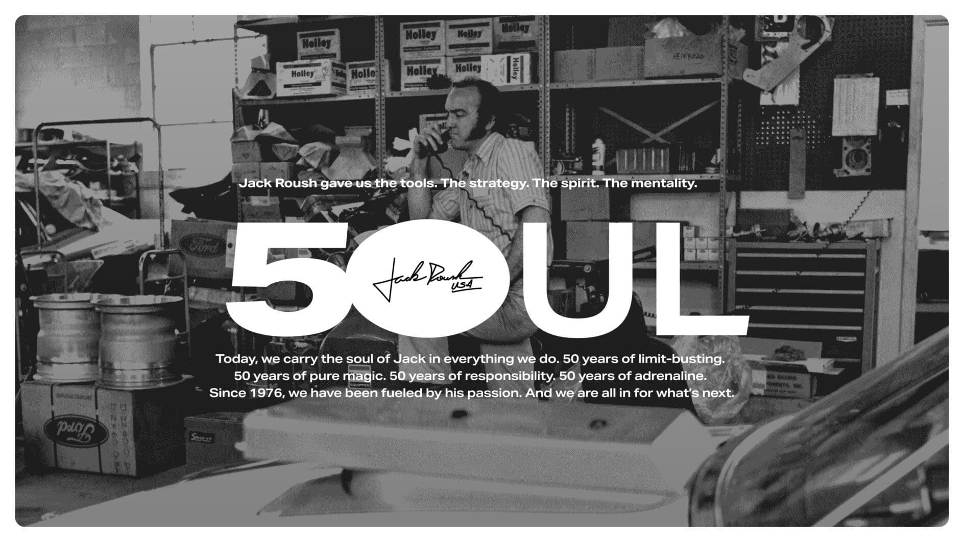 Black and white image of a man in a workshop with shelves of car parts. Large text reads "50UL," highlighting 50 years of legacy and passion.