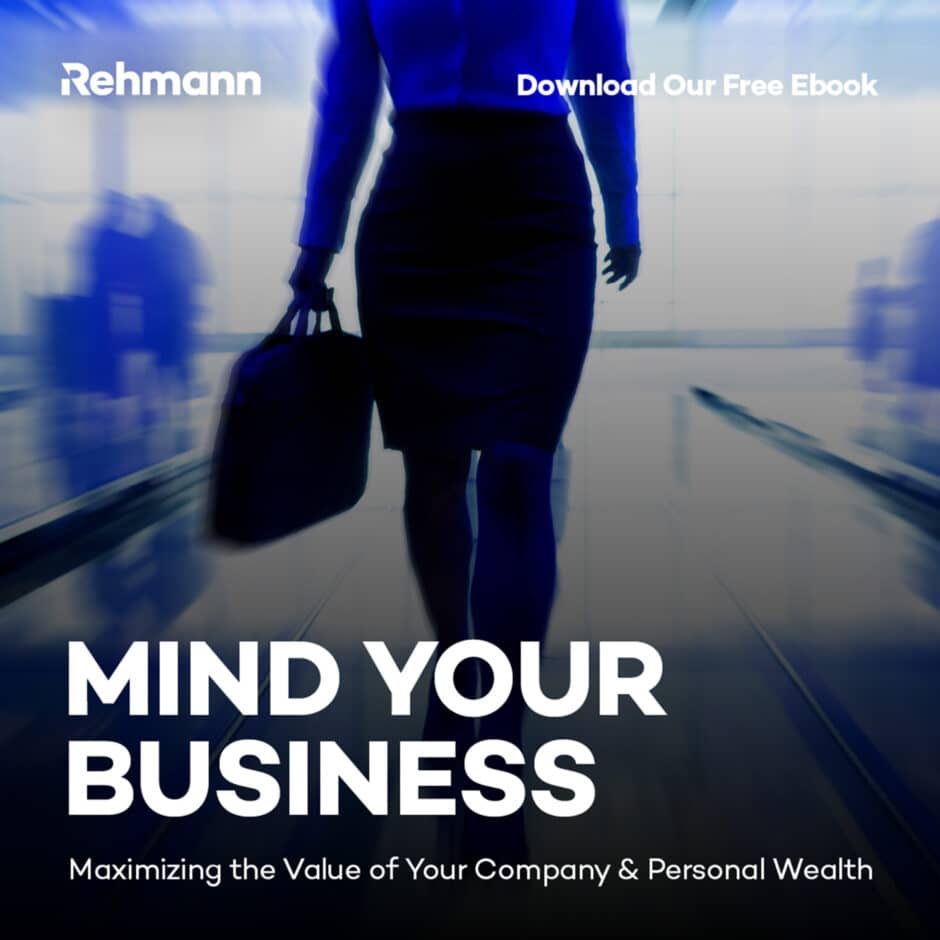 Silhouetted businesswoman with a briefcase walking in a blurred office, with text overlay: “Mind Your Business” and “Maximizing Your Company & Wealth.”