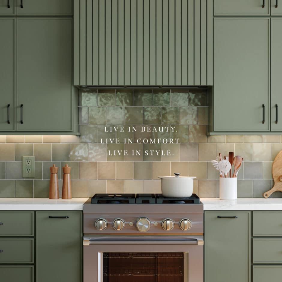 Elegant kitchen with sage green cabinetry, a stainless steel range, glossy tile backsplash, and the text “Live in Beauty. Live in Comfort. Live in Style.”